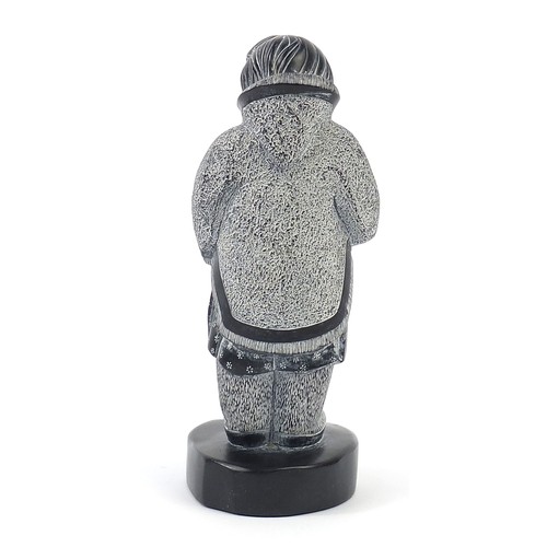1002 - Boma, Canadia Inuit carving of an Eskimo holding a doll, 21cm high