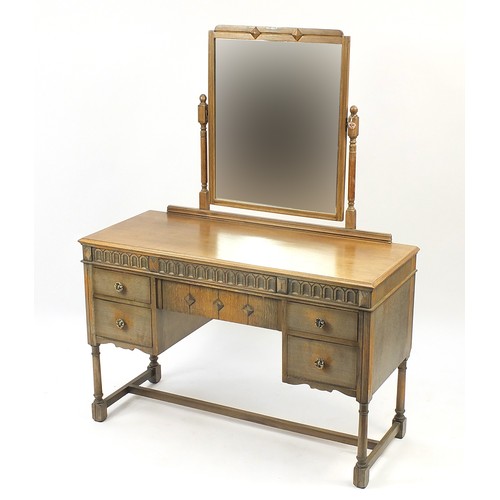 1021A - Austinsuite, oak dressing table with mirrored back and five drawers, 152cm H x 117cm W x 50cm D