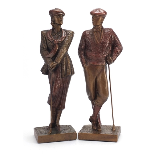 2427 - Hand painted plaster figures of golfers, the largest 42cm high