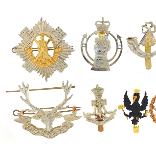 3470 - Eleven British military Staybright cap badges including The Royal Scots and The Green Howards