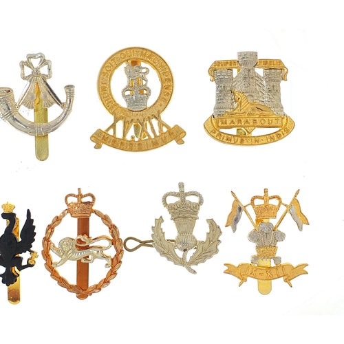 3470 - Eleven British military Staybright cap badges including The Royal Scots and The Green Howards