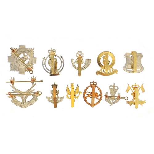 3470 - Eleven British military Staybright cap badges including The Royal Scots and The Green Howards