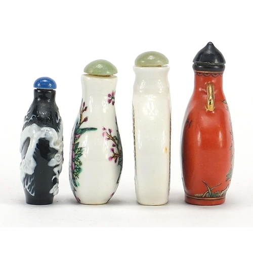 2423 - Four Chinese snuff bottles including a cameo glass example, the largest 7.5cm high