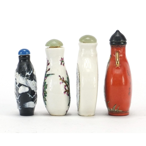 2423 - Four Chinese snuff bottles including a cameo glass example, the largest 7.5cm high