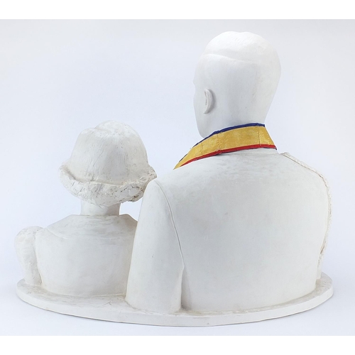 2432 - Large plaster sculpture of a man and girl, 65cm wide