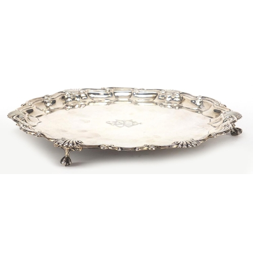 575 - Goldsmiths & Silversmiths Company Ltd, Edward VII silver salver raised on three ball and claw feet, ... 