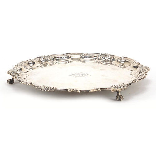 575 - Goldsmiths & Silversmiths Company Ltd, Edward VII silver salver raised on three ball and claw feet, ... 