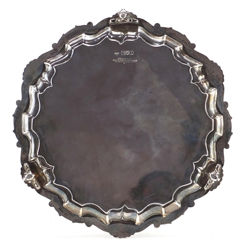 575 - Goldsmiths & Silversmiths Company Ltd, Edward VII silver salver raised on three ball and claw feet, ... 