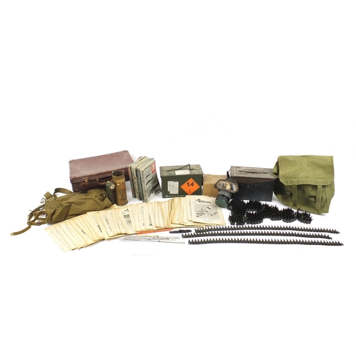 3522 - Militaria including ammunition tins, trench art shell case engraved with a dragon and gas mask