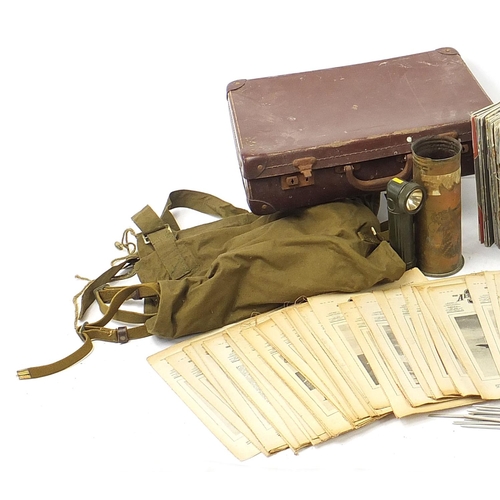 3522 - Militaria including ammunition tins, trench art shell case engraved with a dragon and gas mask