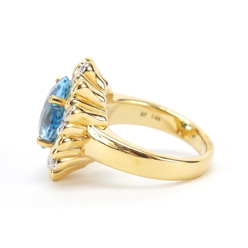 269 - 14ct gold blue topaz and diamond ring, size R, 6.0g