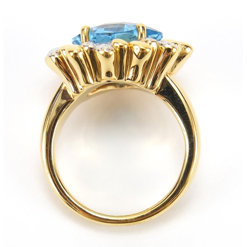 269 - 14ct gold blue topaz and diamond ring, size R, 6.0g