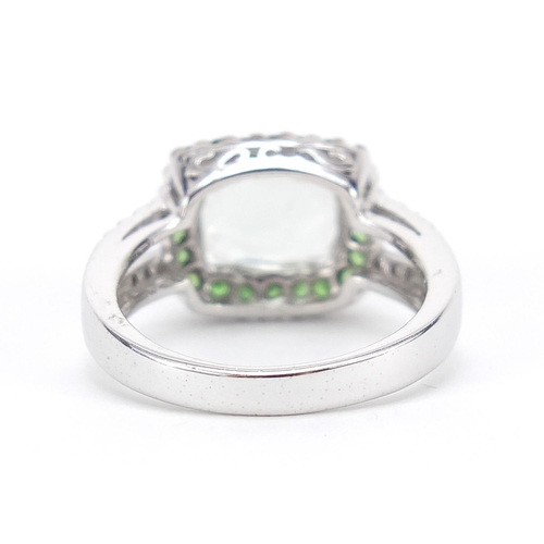 284 - 9ct white gold aquamarine and green stone ring, with diamond shoulders, size N/O, 4.6g