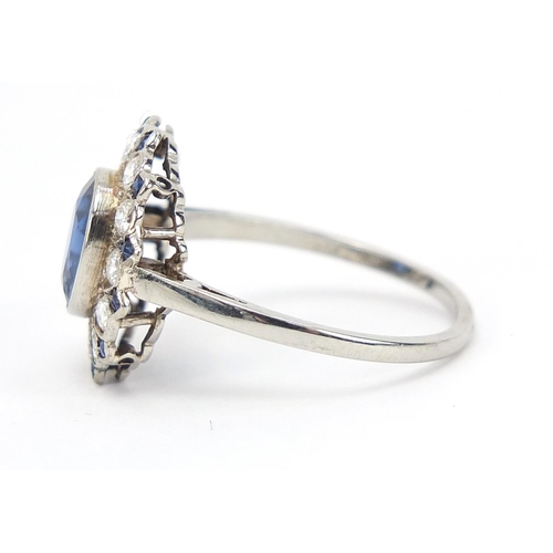 389 - 18ct white gold blue stone and diamond cluster ring, size Q, 2.6g