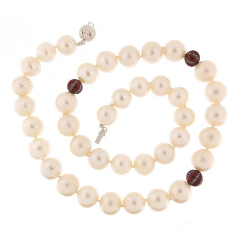 435 - Cultured pearl necklace with 18ct white gold clasp and red glass marcasite spacers, 44cm in length