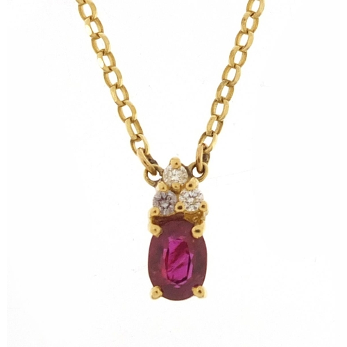 409 - 18ct gold ruby and diamond pendant on an 18ct gold necklace, 1.1cm high and 48cm in length, total 3.... 