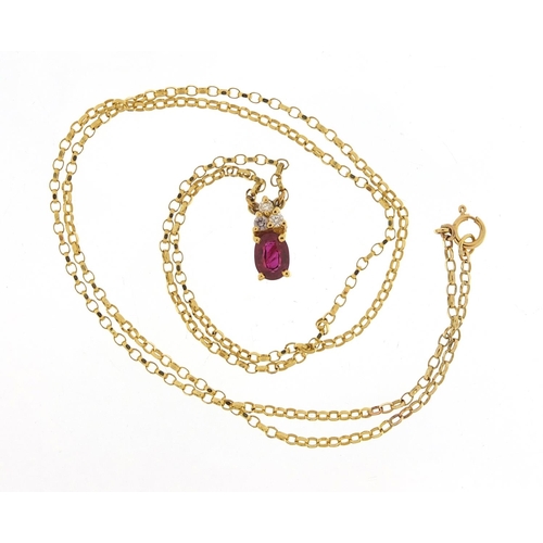 409 - 18ct gold ruby and diamond pendant on an 18ct gold necklace, 1.1cm high and 48cm in length, total 3.... 