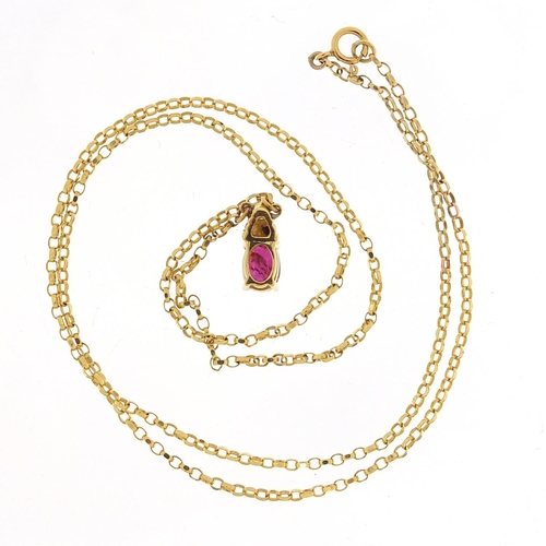 409 - 18ct gold ruby and diamond pendant on an 18ct gold necklace, 1.1cm high and 48cm in length, total 3.... 