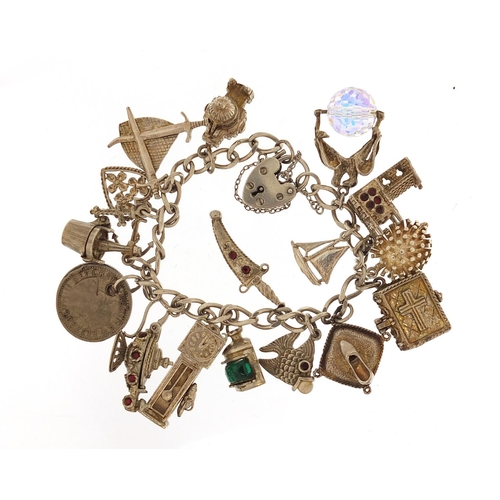 2802 - Silver charm bracelet with selection of charms including hedgehog, church, dagger and bible, 61.5g