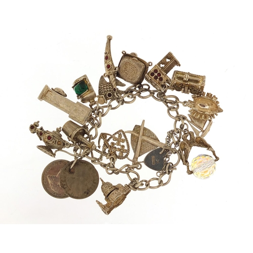 2802 - Silver charm bracelet with selection of charms including hedgehog, church, dagger and bible, 61.5g