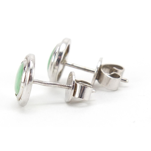 422 - Pair of Chinese unmarked white metal and green jade stud earrings, 1cm in diameter, 3.0g