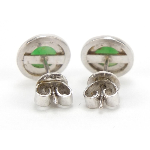 422 - Pair of Chinese unmarked white metal and green jade stud earrings, 1cm in diameter, 3.0g