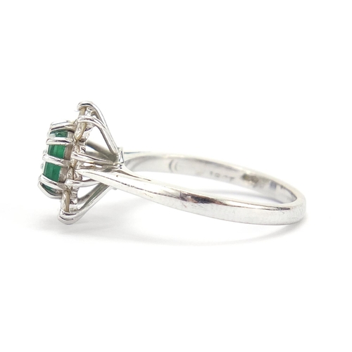 299 - 18ct white gold emerald and diamond ring, each diamond approximately 2.0mm in diameter, size K, 3.0g