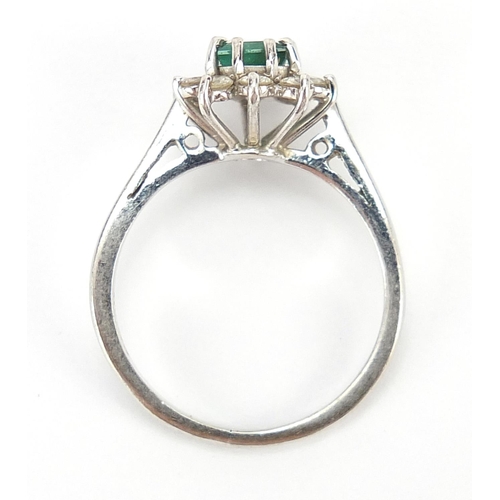 299 - 18ct white gold emerald and diamond ring, each diamond approximately 2.0mm in diameter, size K, 3.0g