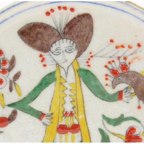 806 - Turkish Kutahya pottery footed plate hand painted with a figure, 14.5cm in diameter