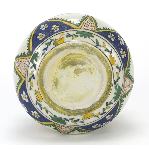 804 - Turkish Kutahya pottery baluster sweet bowl and cover hand painted with flowers, 15cm high