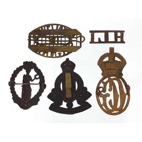 3465 - Five military interest cap badges including Royal Corps of Signals and Royal Army Ordinance Corps