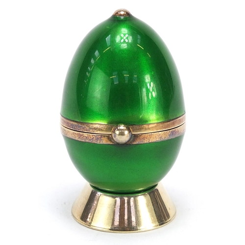 579 - Penhaligons, sterling silver gilt and guilloche enamel egg shaped scent bottle with stand, 5.5cm hig... 