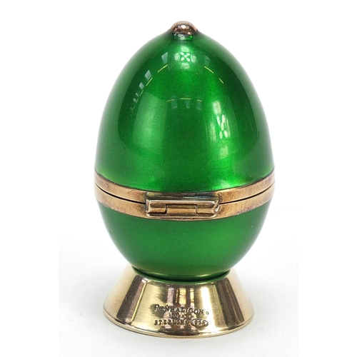 579 - Penhaligons, sterling silver gilt and guilloche enamel egg shaped scent bottle with stand, 5.5cm hig... 