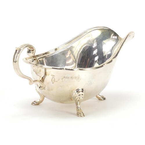 578 - C W Fletcher & Son Ltd, George VI silver sauce boat raised on three hoof feet, Sheffield 1938, 17cm ... 