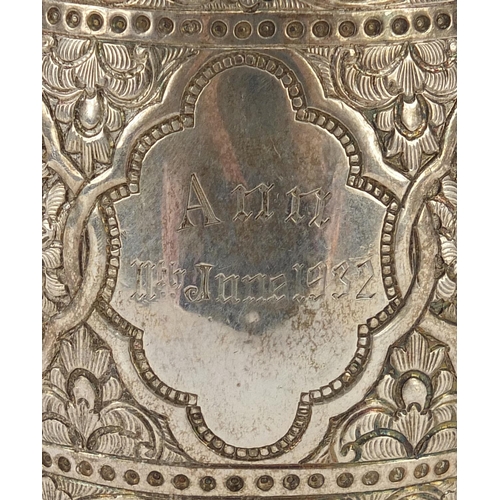 742 - William Hutton & Son, Victorian silver tankard profusely engraved in the Persian style with birds of... 