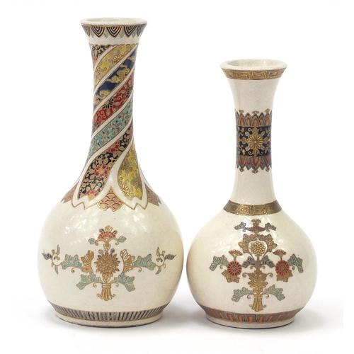 719 - Two Japanese Satsuma pottery bottle vases hand painted with flowers, the largest 18cm