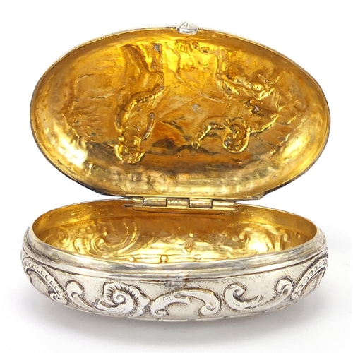 580 - Antique Continental silver snuff box, embossed with figures and gilt interior, impressed marks to th... 