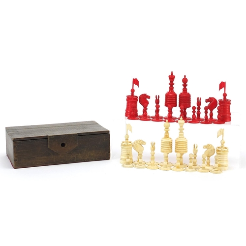 511 - 19th century half stained carved bone chess set, the largest pieces each 12cm high