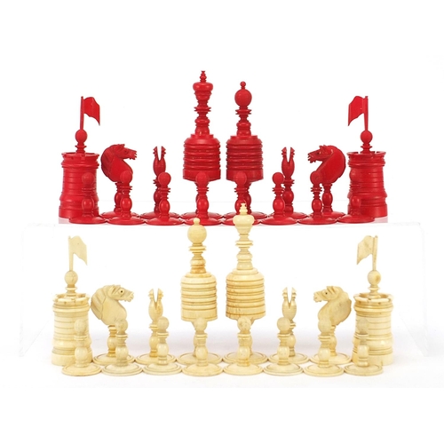 511 - 19th century half stained carved bone chess set, the largest pieces each 12cm high