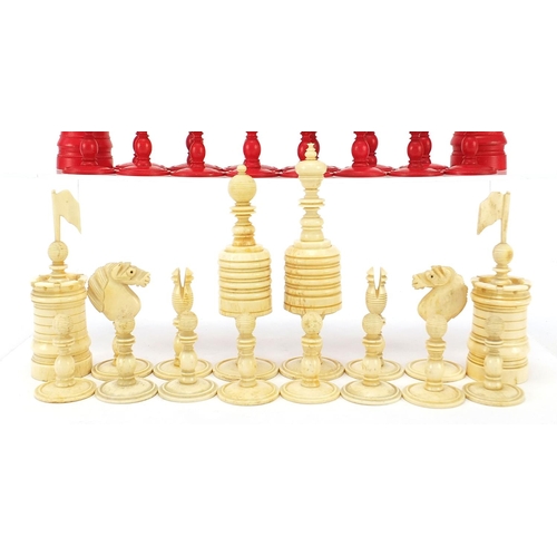 511 - 19th century half stained carved bone chess set, the largest pieces each 12cm high