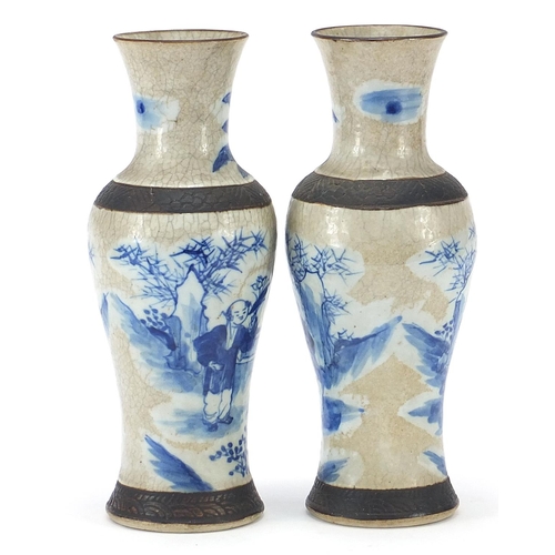 518 - Pair of Chinese blue and white porcelain baluster vases hand painted with figures in a palace settin... 