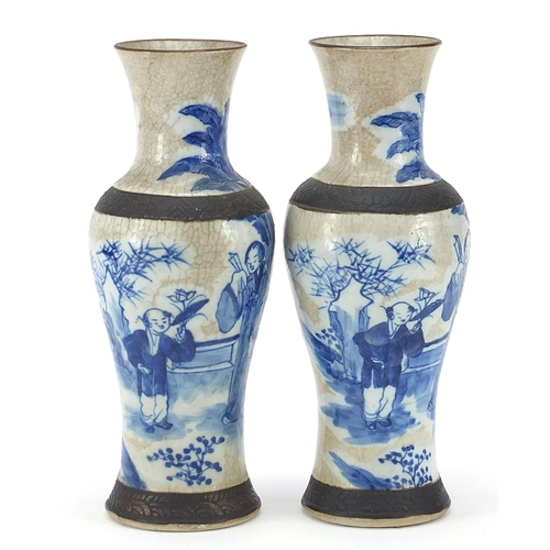 518 - Pair of Chinese blue and white porcelain baluster vases hand painted with figures in a palace settin... 