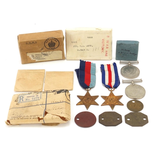 3457 - Four British military World War II medals and dog tags with two boxes