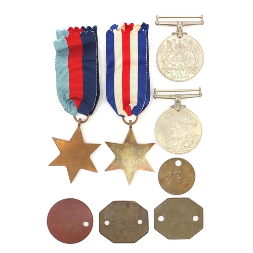 3457 - Four British military World War II medals and dog tags with two boxes