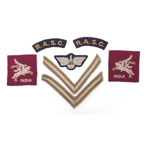 3500 - Seven British military World War II cloth badges including pair of RASC Titles, pair of rank strips,... 