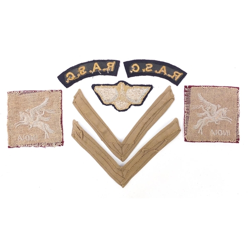 3500 - Seven British military World War II cloth badges including pair of RASC Titles, pair of rank strips,... 