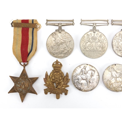 3454 - British militaria including four World War II medals, Intelligence Corps cap badge, Elizabeth II Gen... 