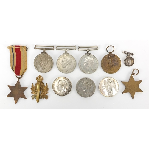 3454 - British militaria including four World War II medals, Intelligence Corps cap badge, Elizabeth II Gen... 