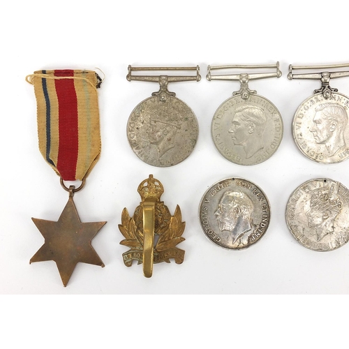 3454 - British militaria including four World War II medals, Intelligence Corps cap badge, Elizabeth II Gen... 