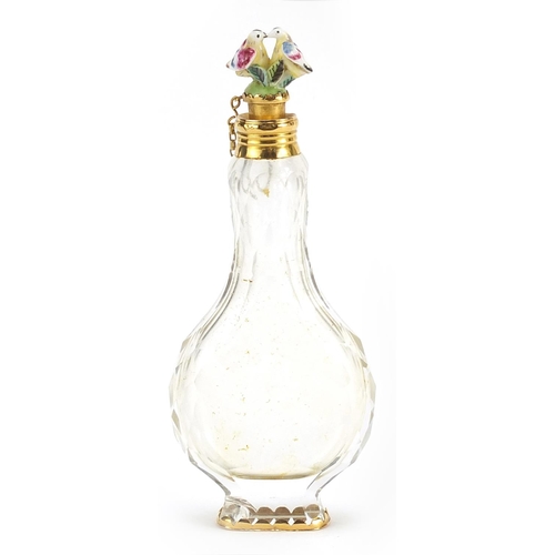 501 - Antique cut glass scent bottle with Chelsea style porcelain bird stopper and gilt metal mounts, hous... 